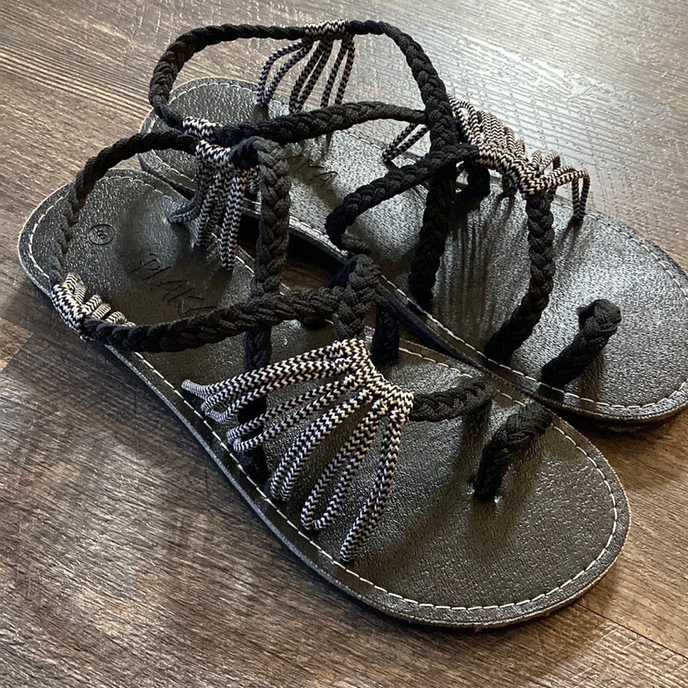 Plaka black rope sandals.